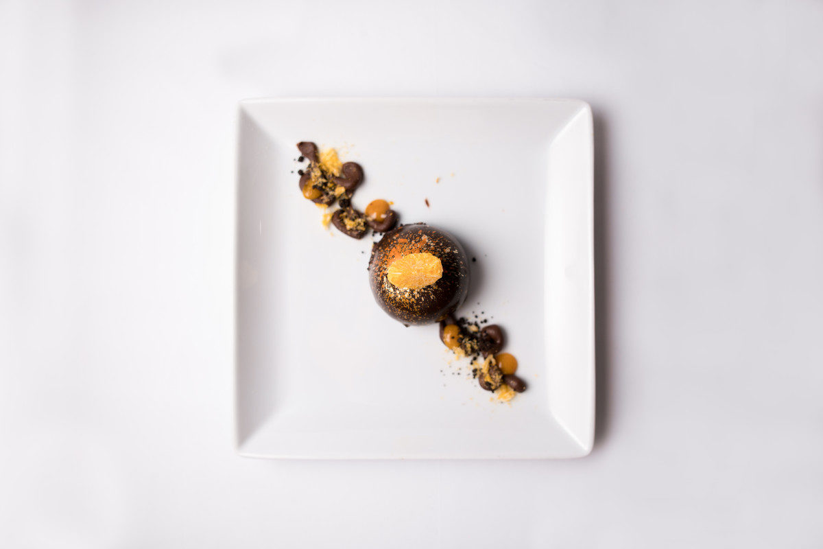 Dessert course by Chef Herve Glin: chocolate hazelnut dome with chocolate crumble & Mandarin vanilla gel. 